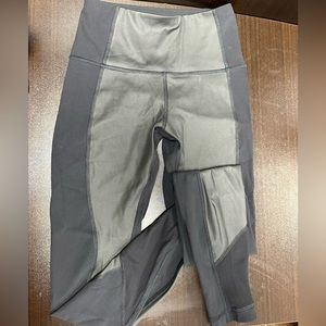 Lululemon mixed fabric black leggings. Size 4, like new.